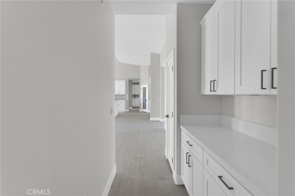 16339 Rimrock Road Apple Valley, CA 92307 - Photo 22 of 50 a spacious bathroom with a sink and a mirror