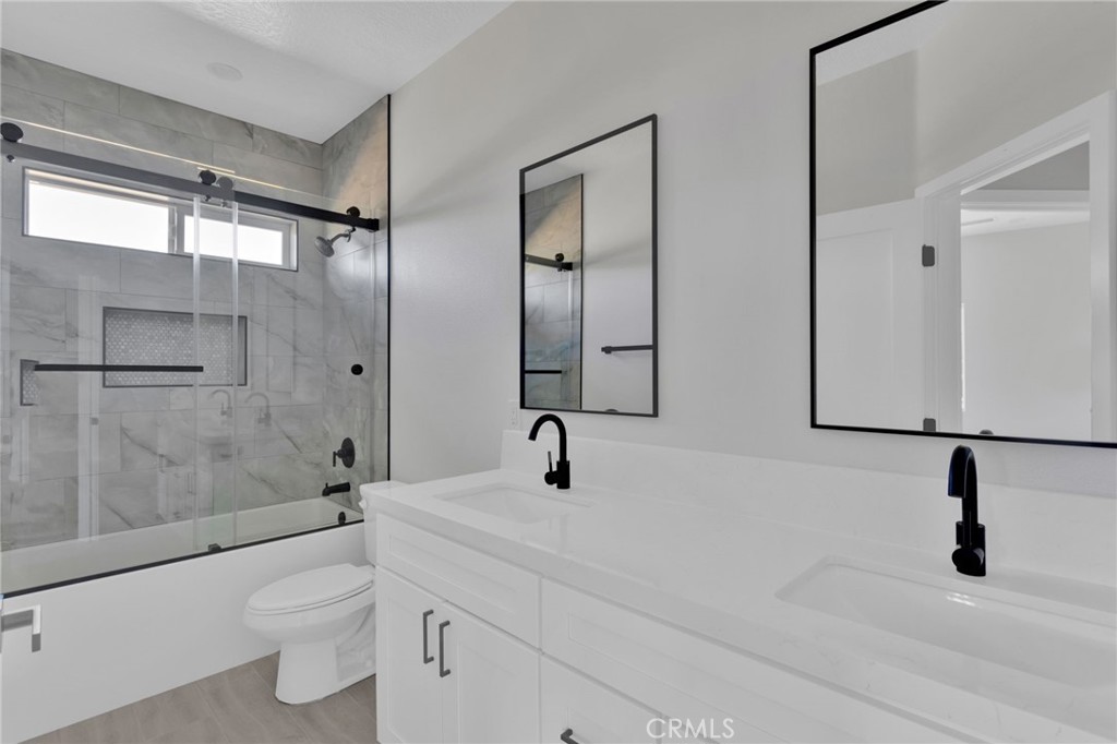 16339 Rimrock Road Apple Valley, CA 92307 - Photo 24 of 50 a bathroom with a sink a toilet and shower