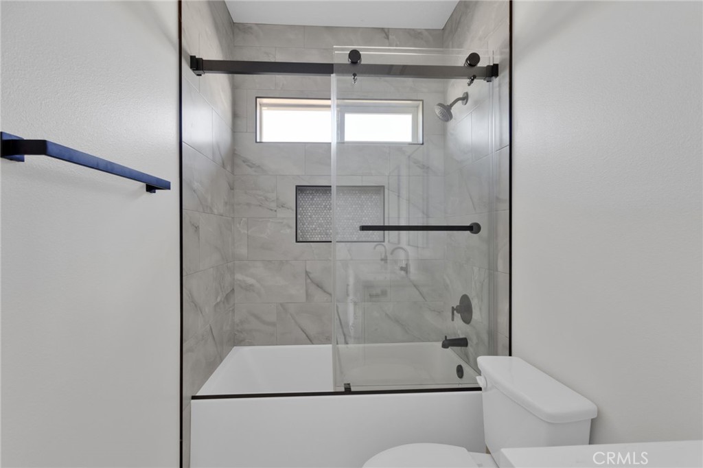 16339 Rimrock Road Apple Valley, CA 92307 - Photo 25 of 50 a bathroom with a shower and toilet