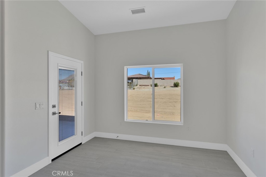 16339 Rimrock Road Apple Valley, CA 92307 - Photo 29 of 50 an empty room with windows