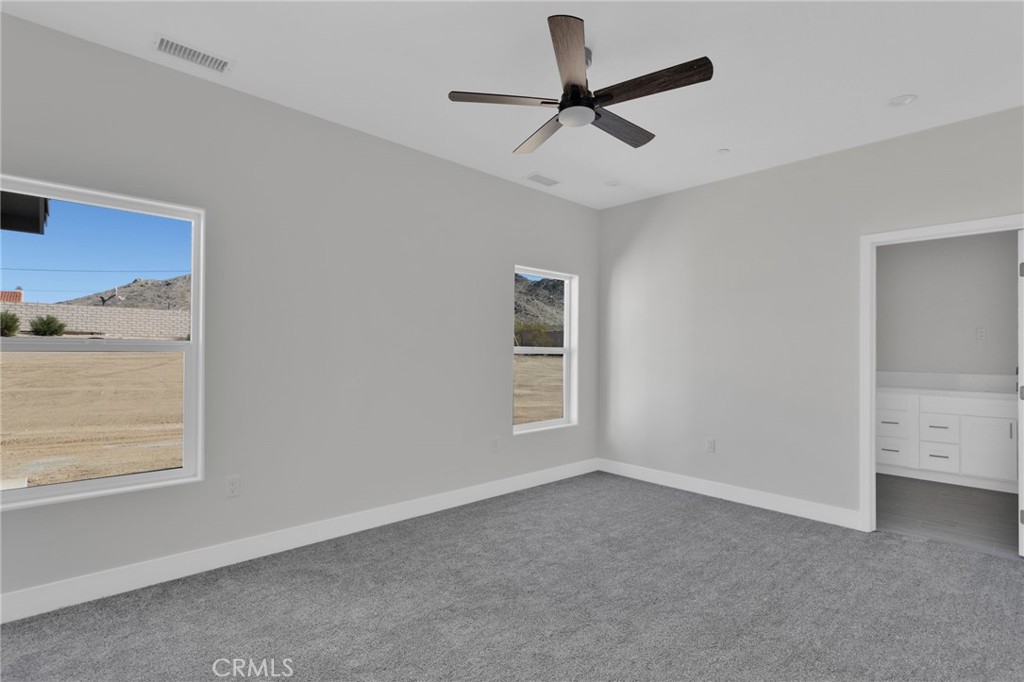 16339 Rimrock Road Apple Valley, CA 92307 - Photo 30 of 50 a view of a livingroom with a ceiling fan and window