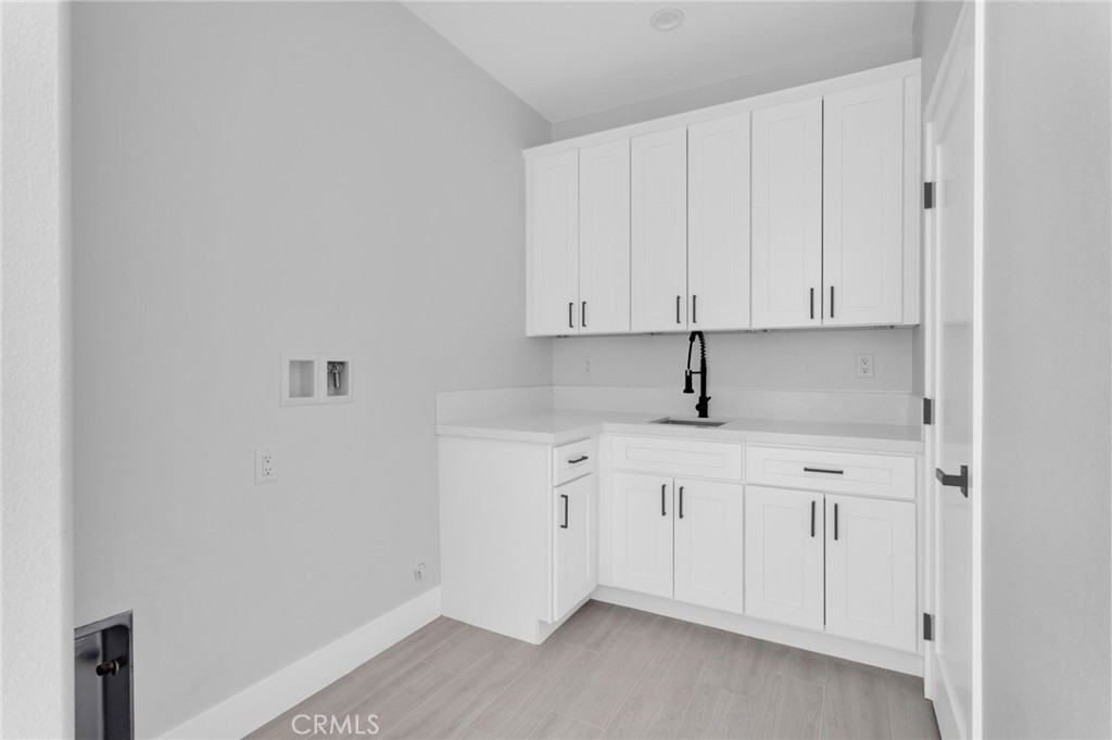 16339 Rimrock Road Apple Valley, CA 92307 - Photo 35 of 50 a view of cabinets with sink