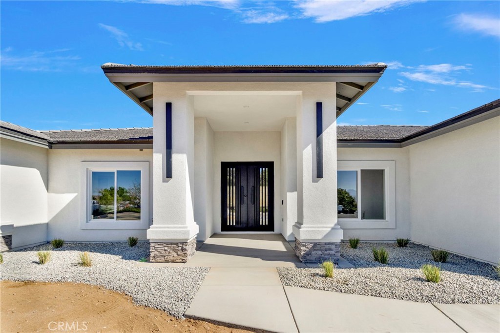 16339 Rimrock Road Apple Valley, CA 92307 - Photo 4 of 50 a front view of a house with outdoor seating