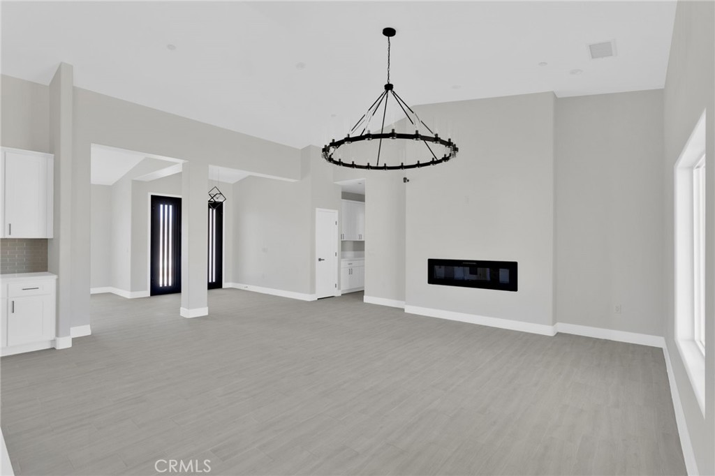 16339 Rimrock Road Apple Valley, CA 92307 - Photo 7 of 50 a view of an empty room with a window