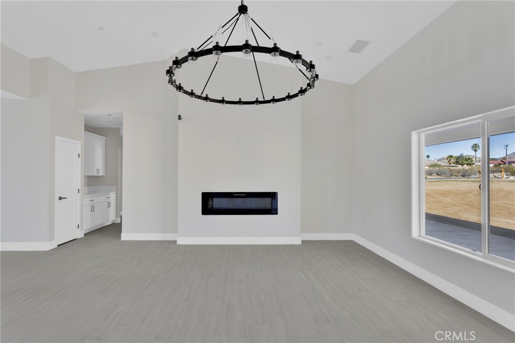 16339 Rimrock Road Apple Valley, CA 92307 - Photo 8 of 50 a view of a room with an empty space and a window