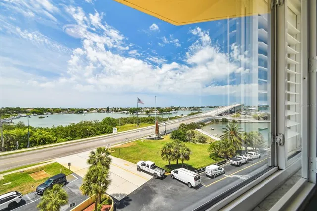 a bathroom with a granite countertop sink a mirror and a shower