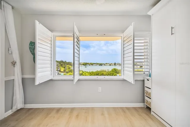 a bathroom with a granite countertop sink mirror and shower