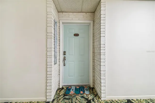 a kitchen with stainless steel appliances granite countertop a sink refrigerator and microwave