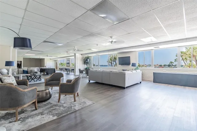 a view of balcony with two chairs and wooden floor