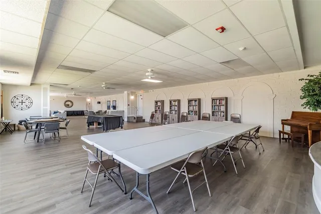 a view of a balcony with wooden floor and city view