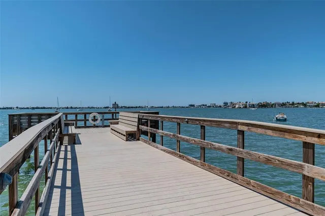 a view of a swimming pool with a table and chairs
