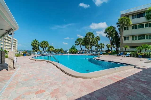 an aerial view of a house a yard and green space