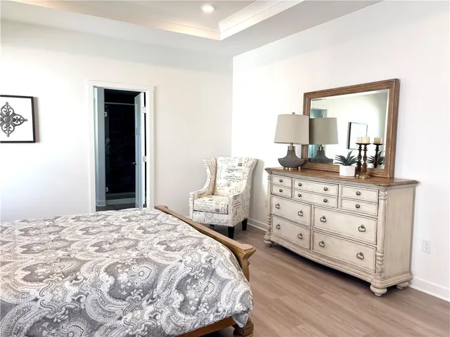 a bedroom with a bed and a dresser