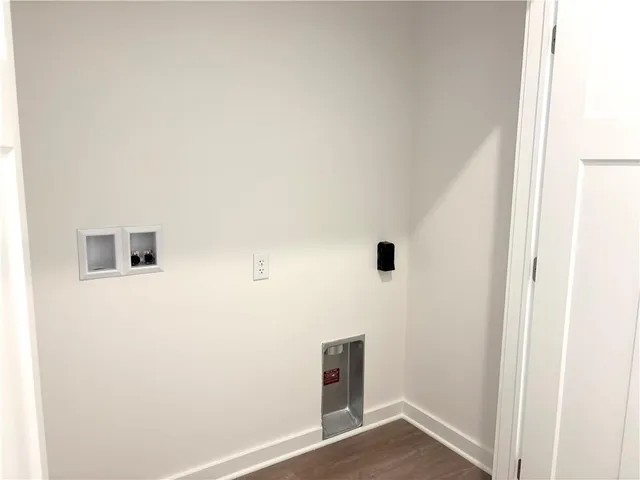 a view of a livingroom with wooden floor