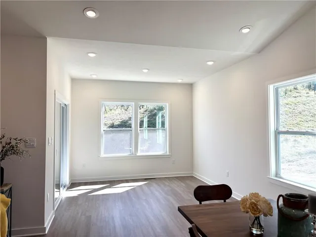 a view of an empty room and a window