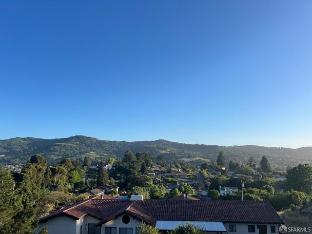 an aerial view of residential house and green space