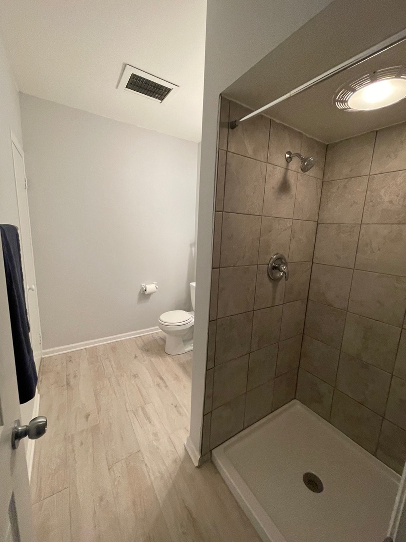 215 Waukegan Road, Unit 2S Lake Bluff, IL 60044 - Photo 12 of 24 a bathroom with a shower and toilet