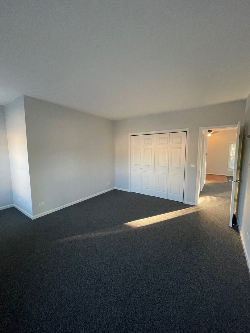 215 Waukegan Road, Unit 2S Lake Bluff, IL 60044 - Photo 16 of 24 a view of empty room with windows