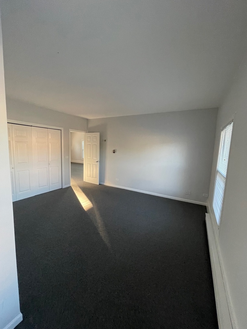 215 Waukegan Road, Unit 2S Lake Bluff, IL 60044 - Photo 17 of 24 a view of an empty room and window
