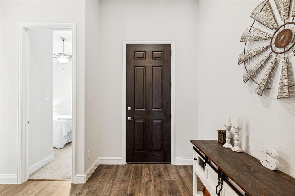 482 Prairie View Drive Haslet, TX 76052 - Photo 11 of 33 a view of a hallway with wooden floor