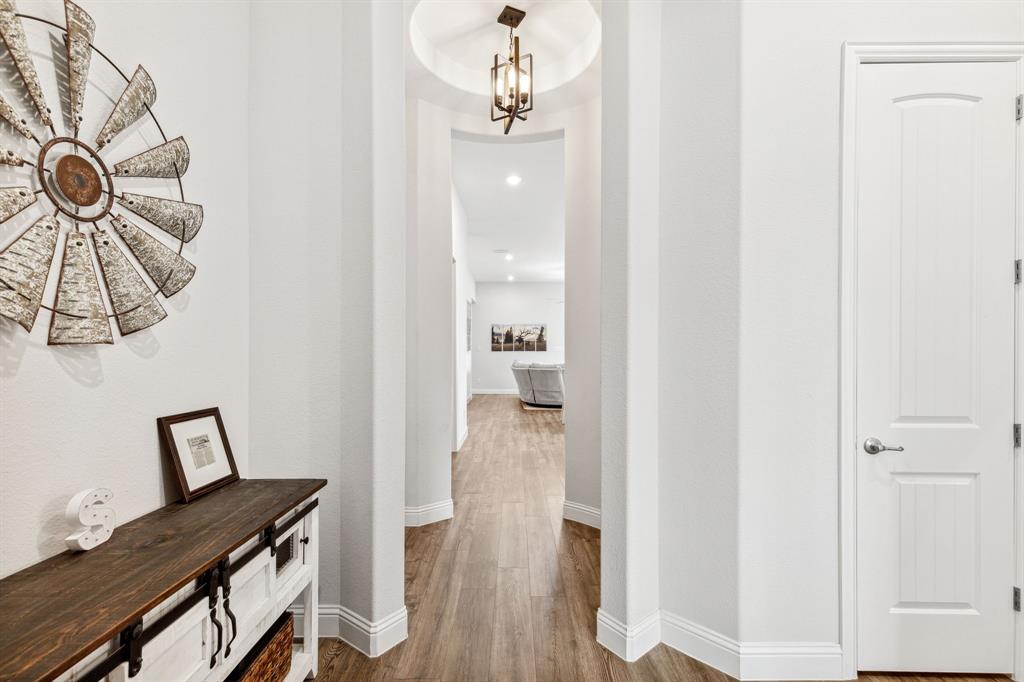 482 Prairie View Drive Haslet, TX 76052 - Photo 12 of 33 a view of a hallway with furniture and wooden floor