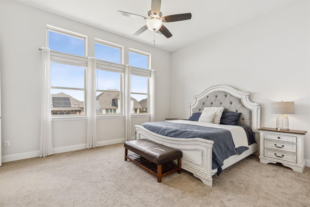 482 Prairie View Drive Haslet, TX 76052 - Photo 18 of 33 a spacious bedroom with a bed and a window