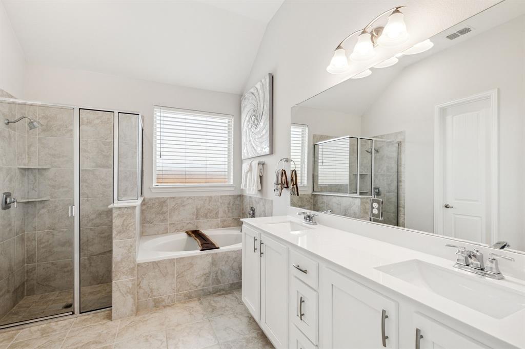 482 Prairie View Drive Haslet, TX 76052 - Photo 22 of 33 a spacious bathroom with a tub sink shower and mirror