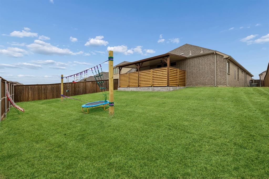 482 Prairie View Drive Haslet, TX 76052 - Photo 27 of 33 a view of a backyard with a garden and stairs