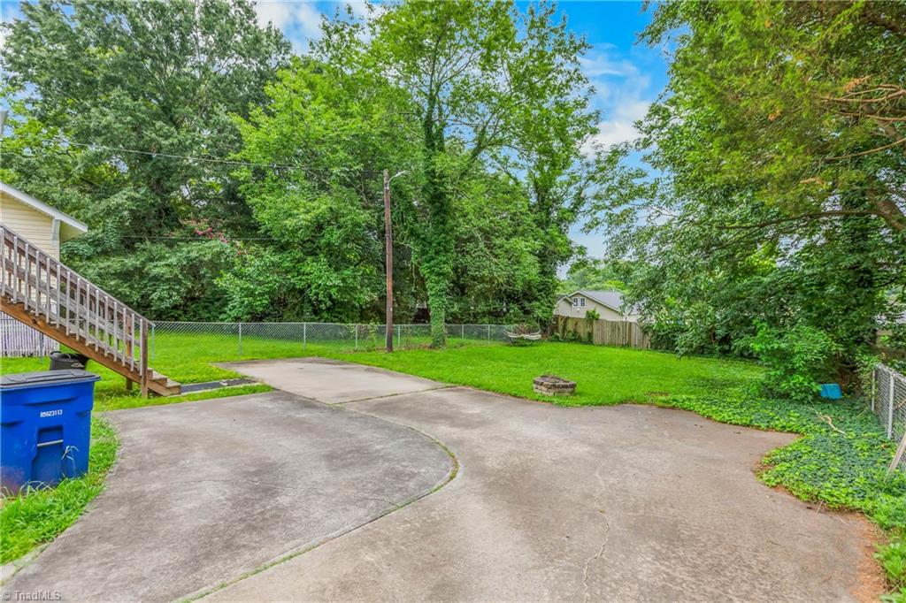 610 Salisbury Ridge Road Winston-Salem, NC 27127 - Photo 20 of 21 The large fenced backyard offers plenty of space to enjoy the outdoors.