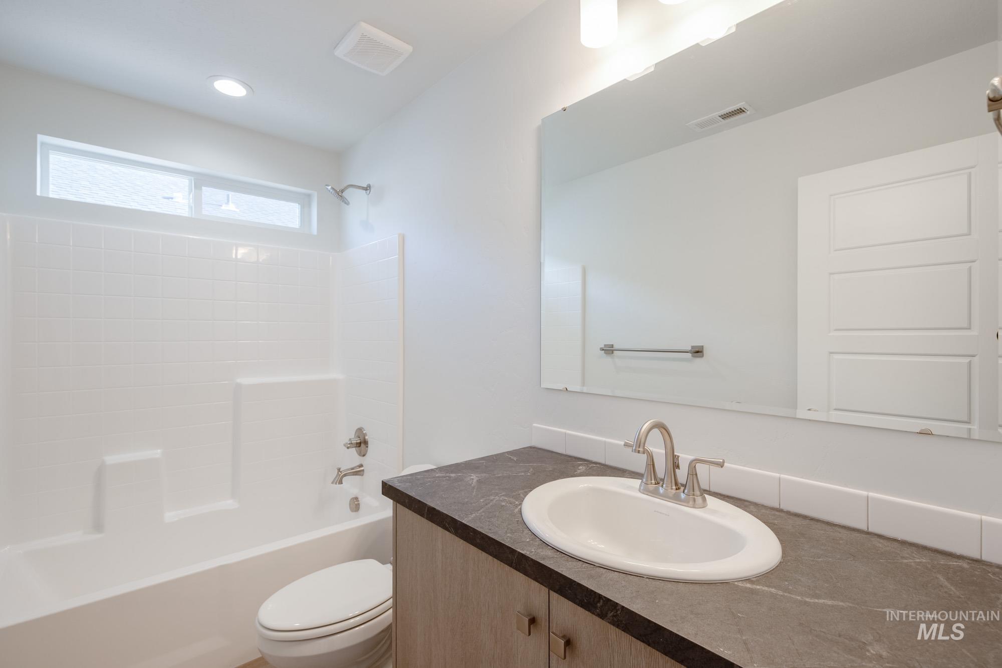 1619 Long Pond Street Middleton, ID 83644 - Photo 16 of 21 Full bathroom with bathing tub / shower combination, vanity, and recessed lighting