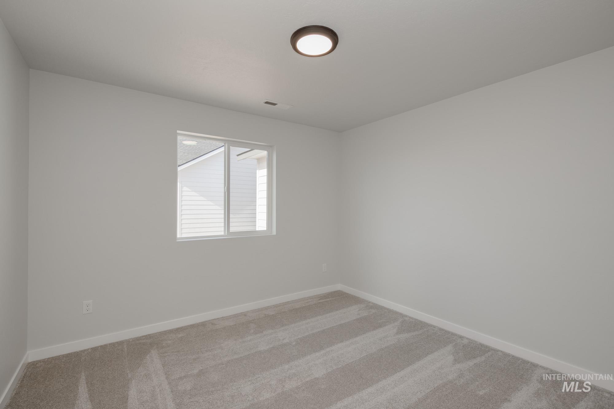 1619 Long Pond Street Middleton, ID 83644 - Photo 18 of 21 Unfurnished room featuring carpet