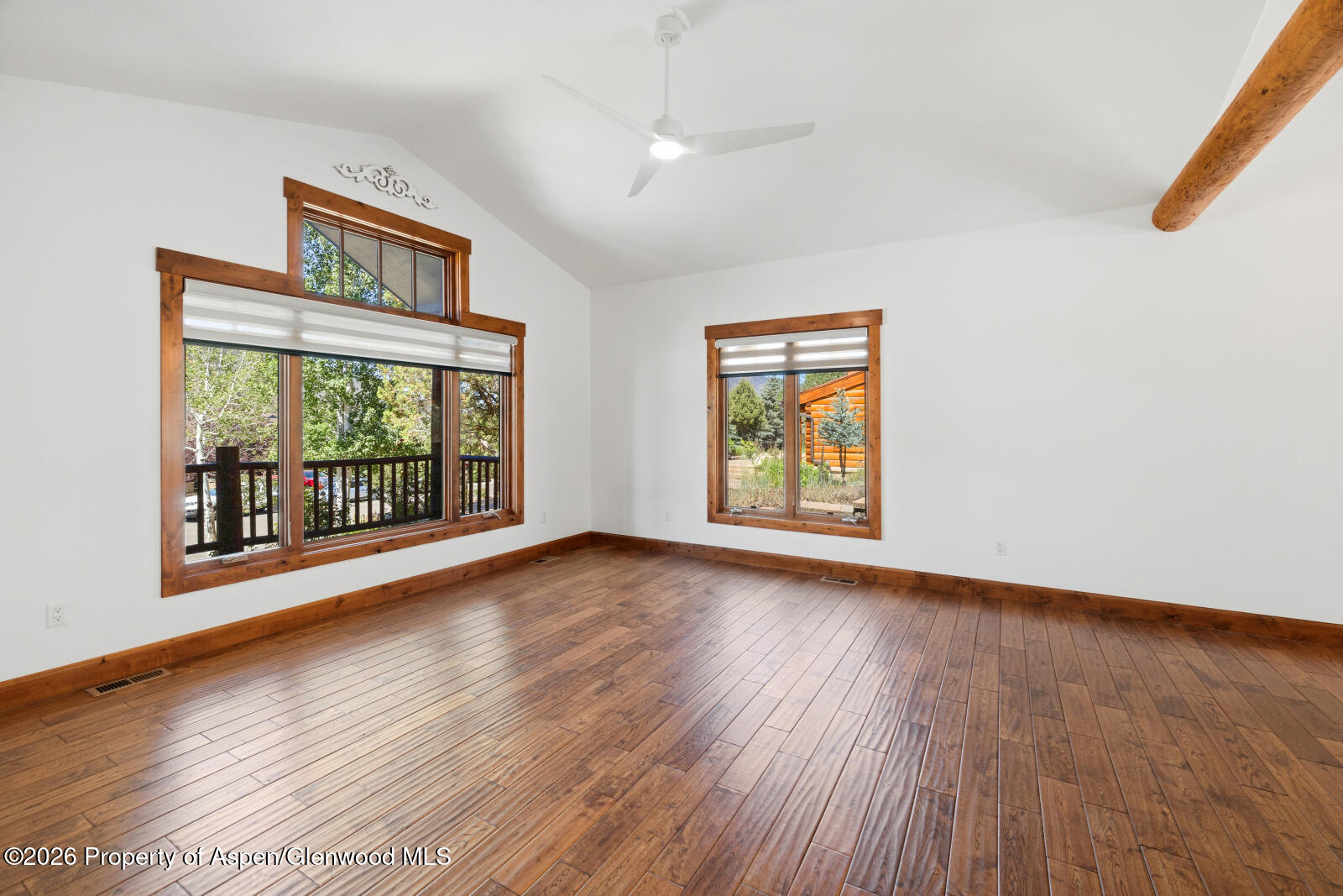 316 Faas Ranch Road New Castle, CO 81647 - Photo 8 of 50 a view of an empty room with wooden floor and a window