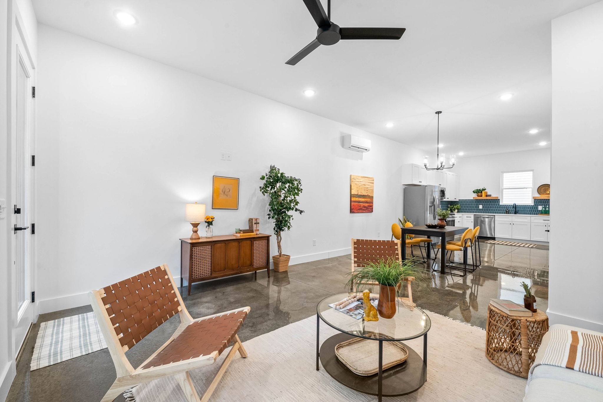684 Anderson Lane Madison, TN 37115 - Photo 5 of 33 a living room with furniture and a dining table with kitchen view