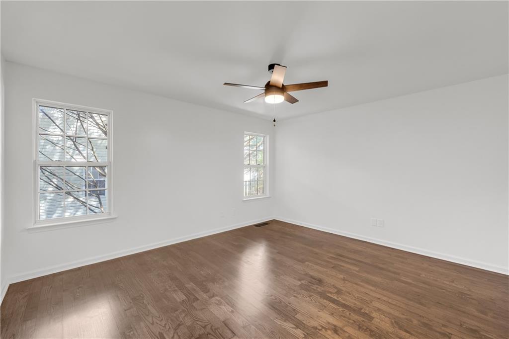 2941 Lake Hollow Road Gainesville, GA 30501 - Photo 23 of 53 a view of an empty room with a window and wooden floor