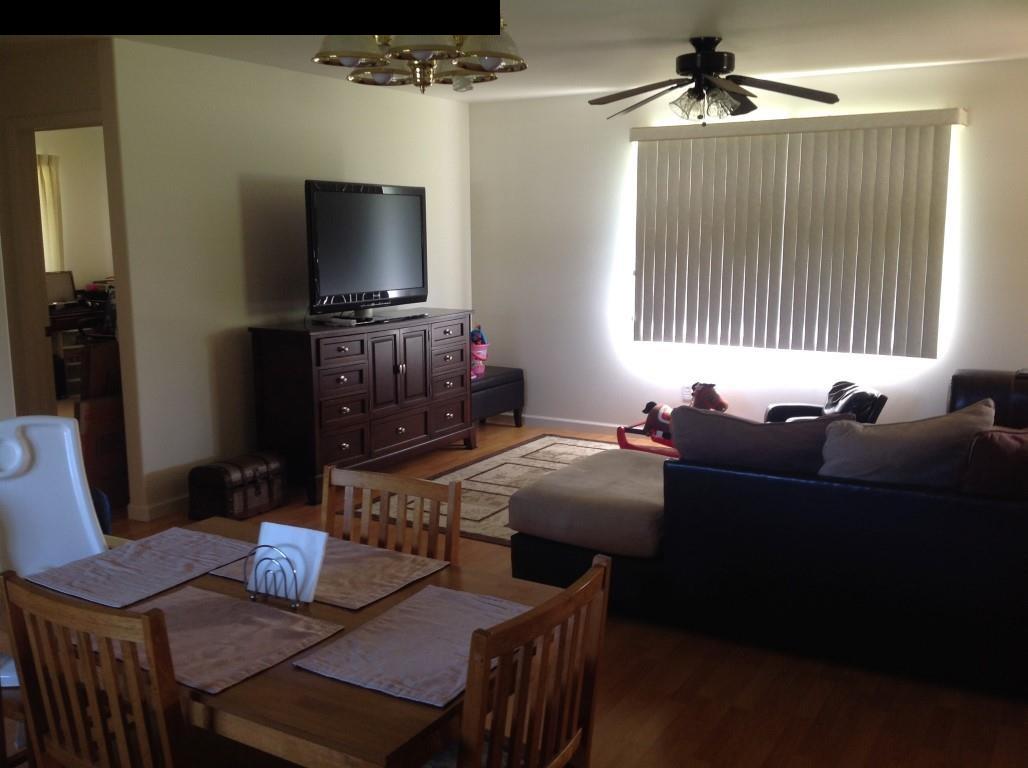 2750 Kokomo Road Haiku, HI 96708 - Photo 14 of 30 a living room with furniture and a flat screen tv