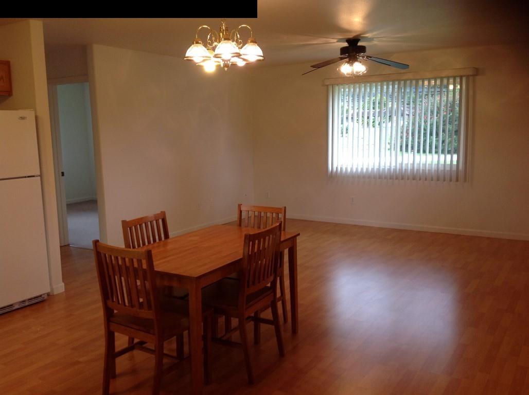 2750 Kokomo Road Haiku, HI 96708 - Photo 17 of 30 a view of a dining room with furniture window and wooden floor
