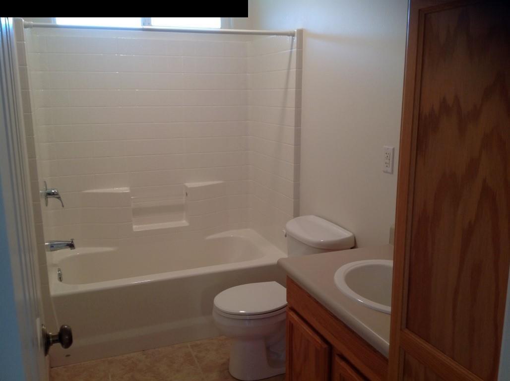 2750 Kokomo Road Haiku, HI 96708 - Photo 18 of 30 a bathroom with a sink a toilet and shower