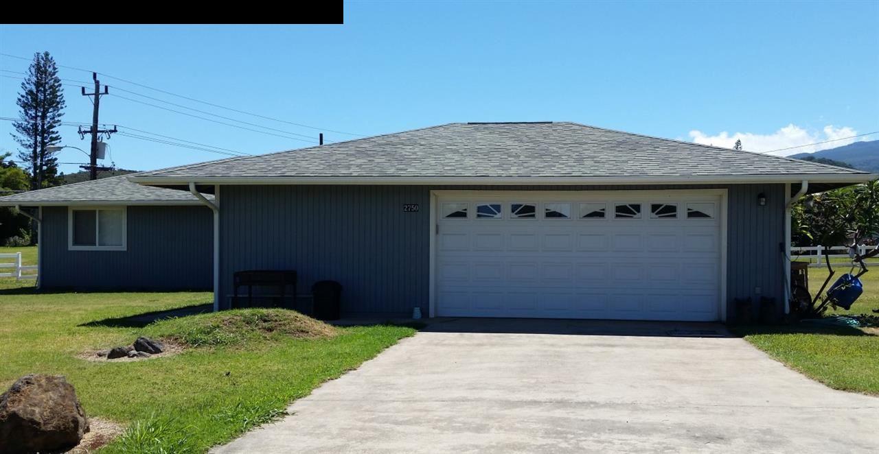 2750 Kokomo Road Haiku, HI 96708 - Photo 24 of 30 a front view of a house with a garden