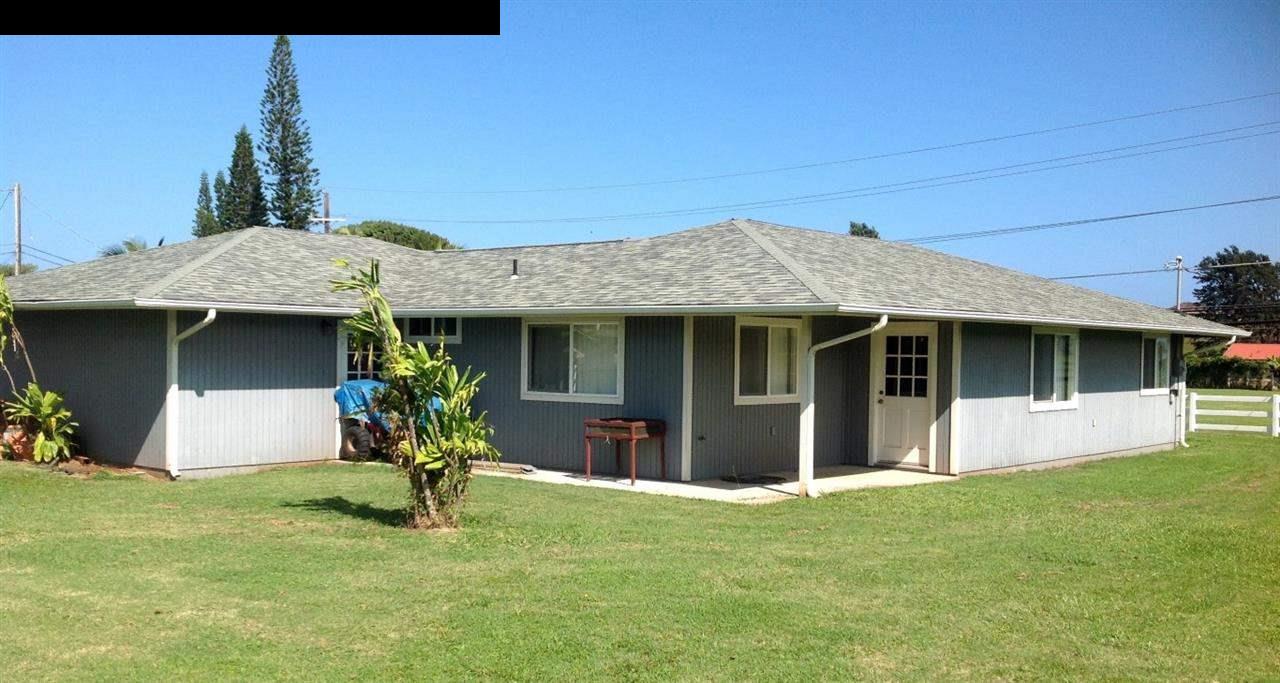 2750 Kokomo Road Haiku, HI 96708 - Photo 25 of 30 a front view of a house with a yard
