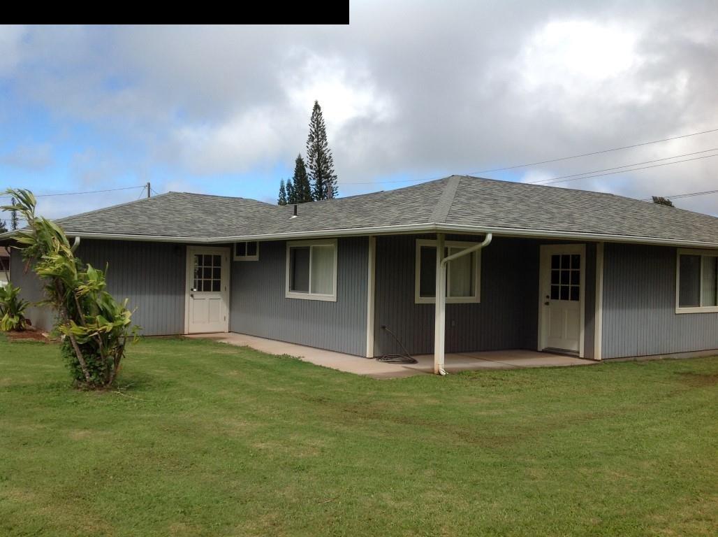 2750 Kokomo Road Haiku, HI 96708 - Photo 27 of 30 a front view of a house with a garden