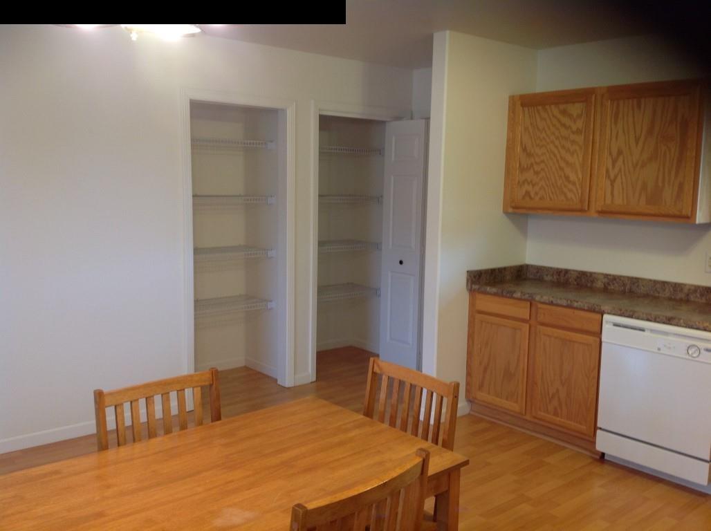 2750 Kokomo Road Haiku, HI 96708 - Photo 5 of 30 a bedroom with a bed and a cabinets