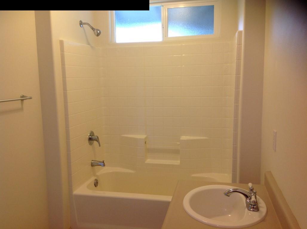 2750 Kokomo Road Haiku, HI 96708 - Photo 10 of 30 a bathroom with a sink and a bathtub