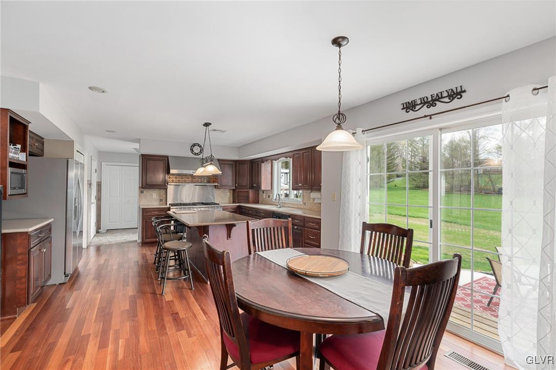 180 West Butternut Road Hellertown, PA 18055 - Photo 19 of 50 a view of a dining room with furniture window and wooden floor