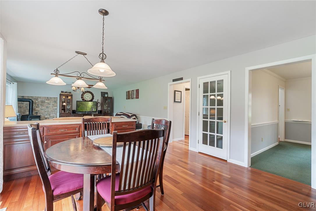 180 West Butternut Road Hellertown, PA 18055 - Photo 21 of 50 a dining room with furniture a chandelier and wooden floor