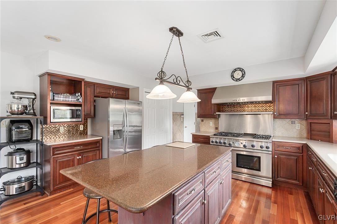 180 West Butternut Road Hellertown, PA 18055 - Photo 23 of 50 a kitchen with a stove a refrigerator and a stove top oven