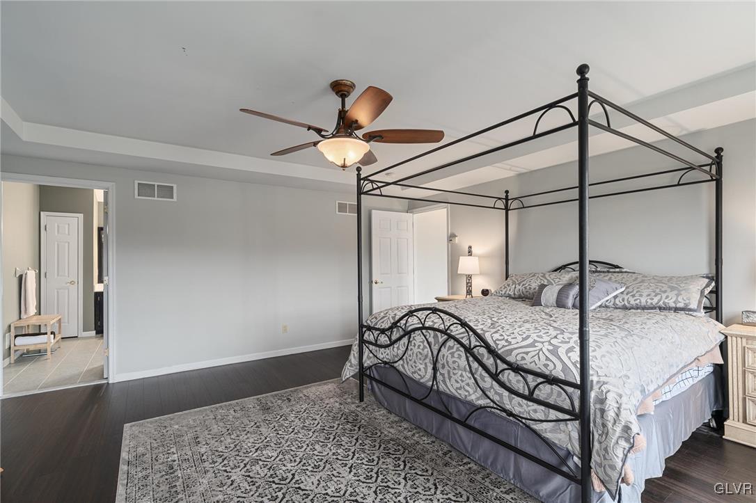 180 West Butternut Road Hellertown, PA 18055 - Photo 37 of 50 a bedroom with a bed and a chandelier