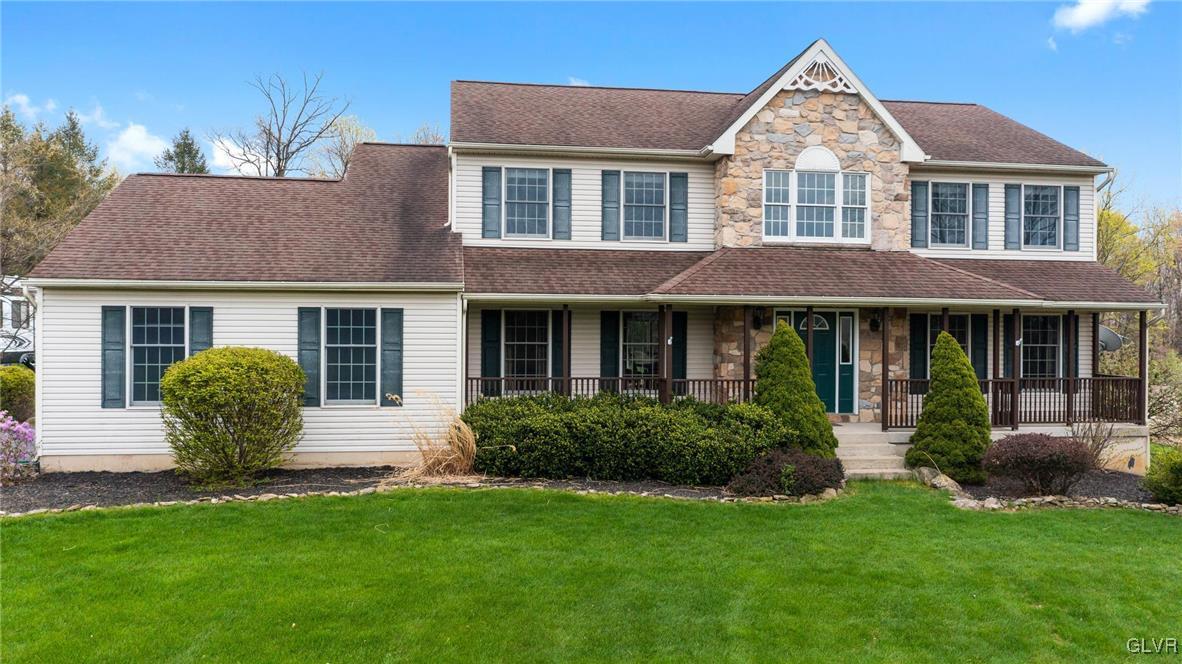 180 West Butternut Road Hellertown, PA 18055 - Photo 4 of 50 a front view of a house with porch and garden
