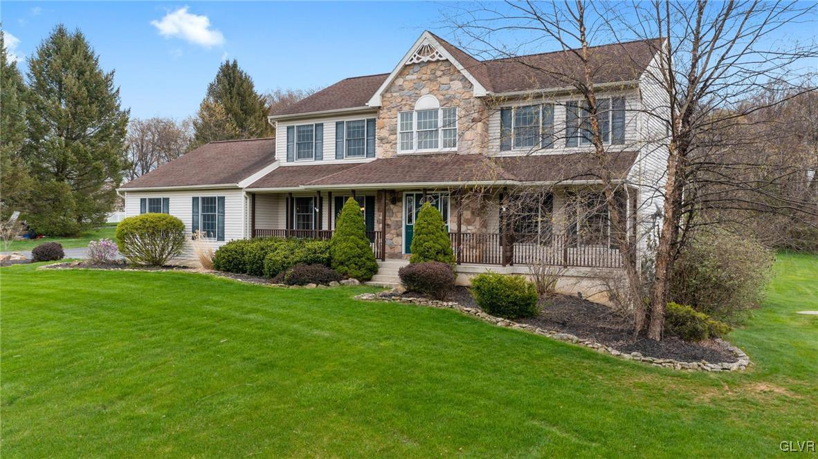 180 West Butternut Road Hellertown, PA 18055 - Photo 5 of 50 a front view of a house with a yard table and chairs