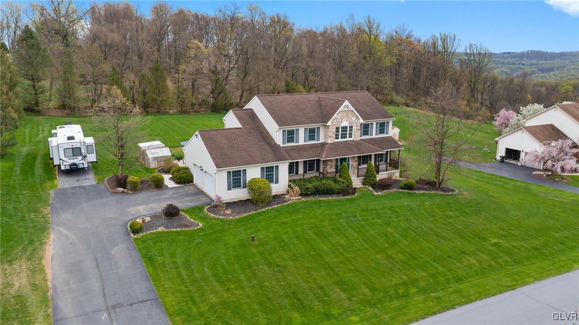 180 West Butternut Road Hellertown, PA 18055 - Photo 7 of 50 a front view of a house with garden
