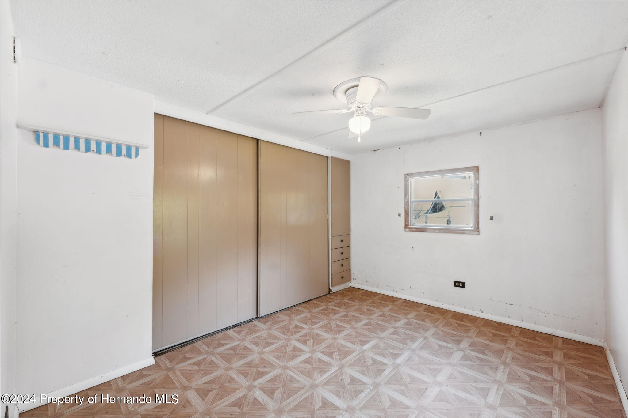 10327 East Victory Lane Inverness, FL 34450 - Photo 15 of 35 a view of an empty room with a window